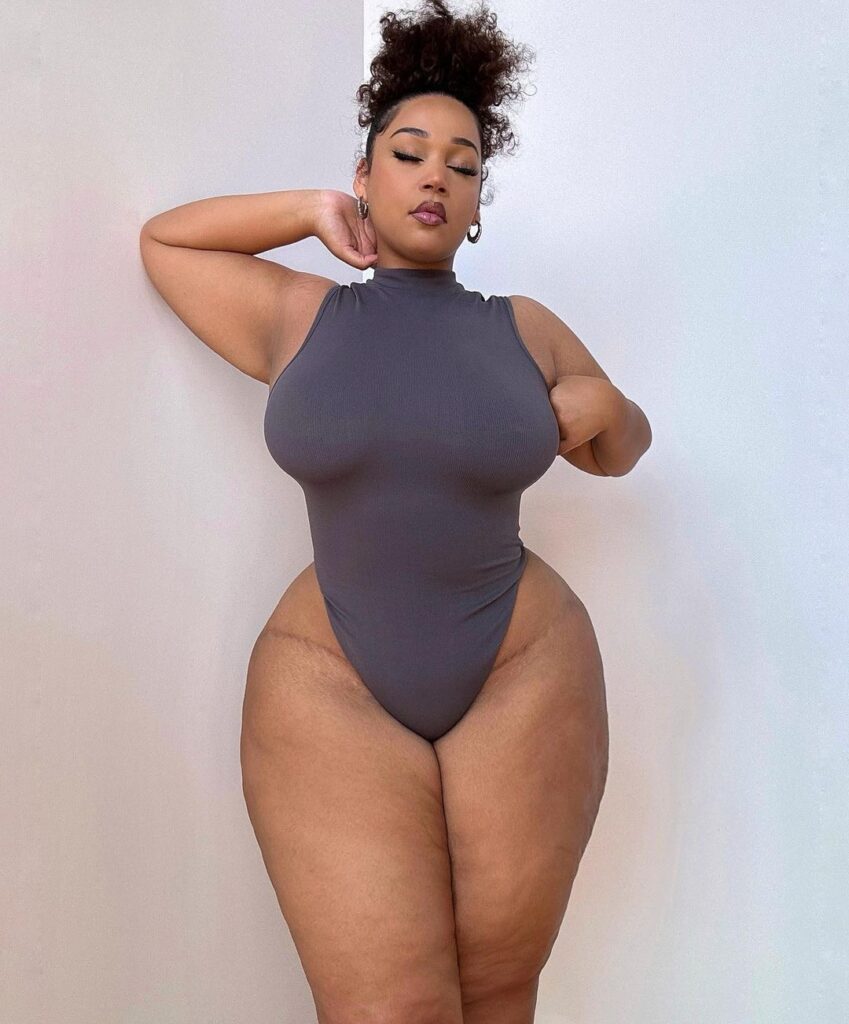 Curvy model strips to lingerie – but fans hit back at trolls for 'fat shaming'